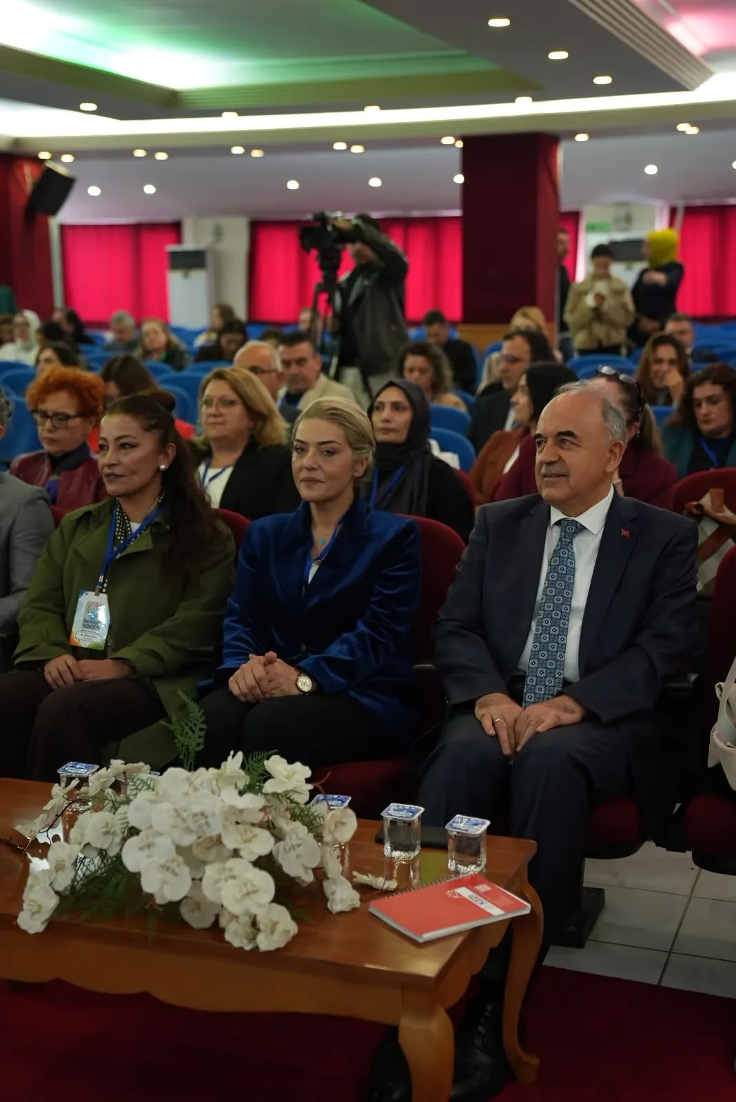 Participants seated in a conference hall